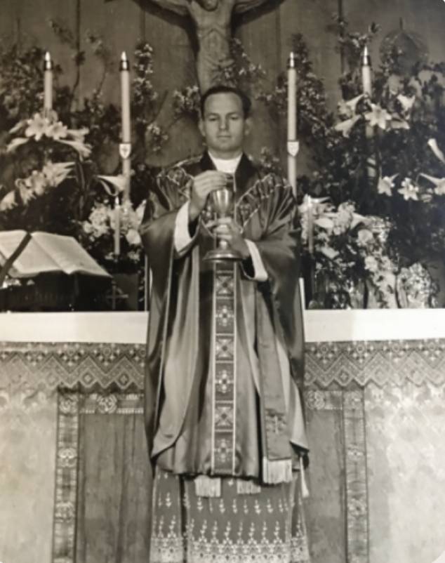 Father Frank at altar
