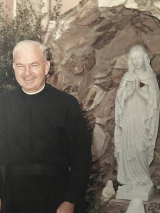 Father Frank at the grotto